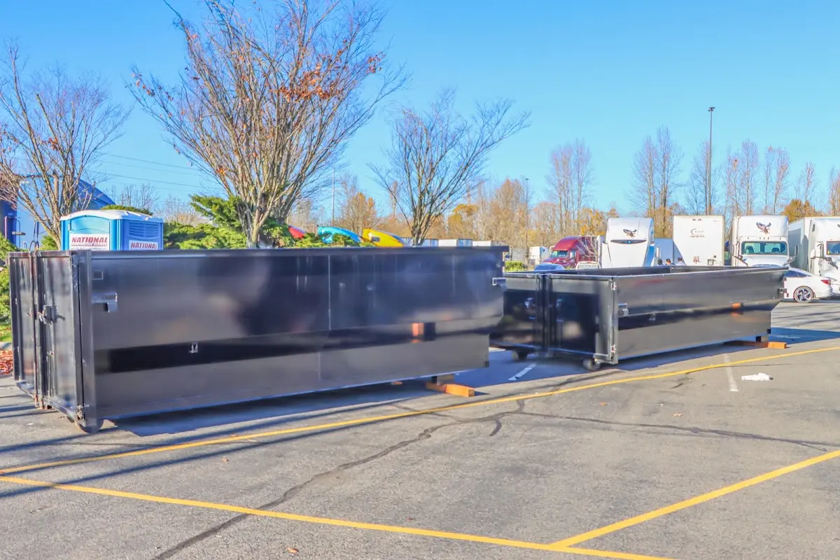 Professional dumpster rental service with roll-off container on residential driveway in Saratoga